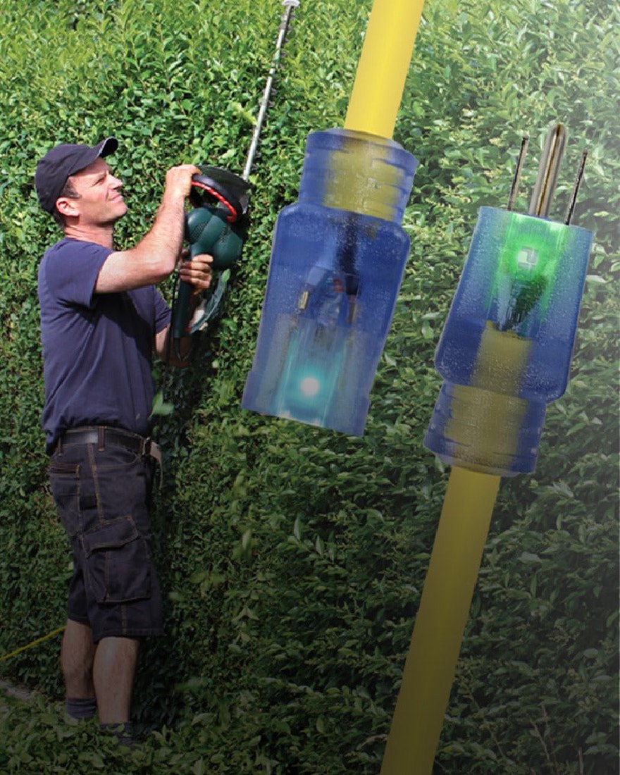 A Prime illuminated extension cord connector in use outdoors